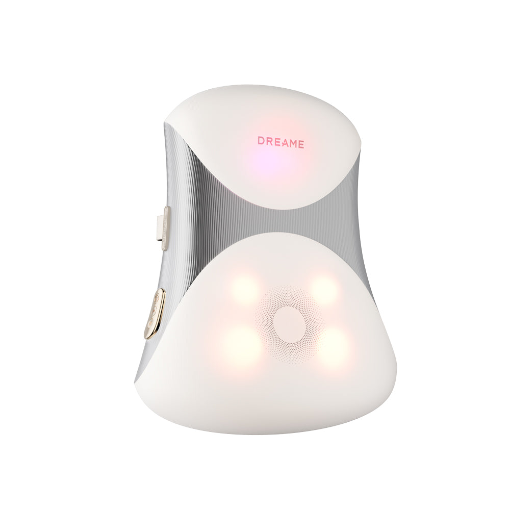 Lumbar massage cushion in white with gray textured side panels and attached strap
