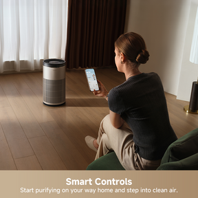 Dreame air purifier used with a smartphone for smart controls while running.