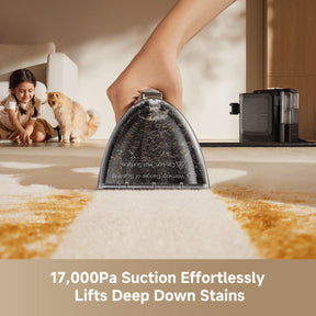 Steam spot cleaner nozzle pouring steam onto a carpeted floor area