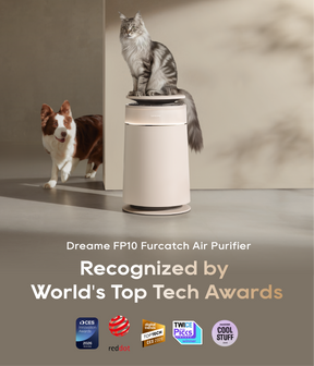White pet air purifier with two cats and a dog standing around it