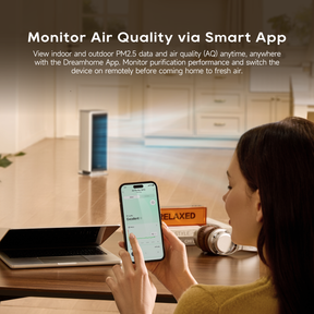 White air purifier fan monitored via smartphone app showing air quality